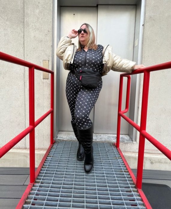 Sarah wears a logo print plus size catsuit from H&M