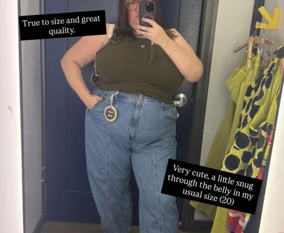 Sarah tries on the olive tank top and barrel leg jeans from the Christopher John Rogers x Old Navy collab