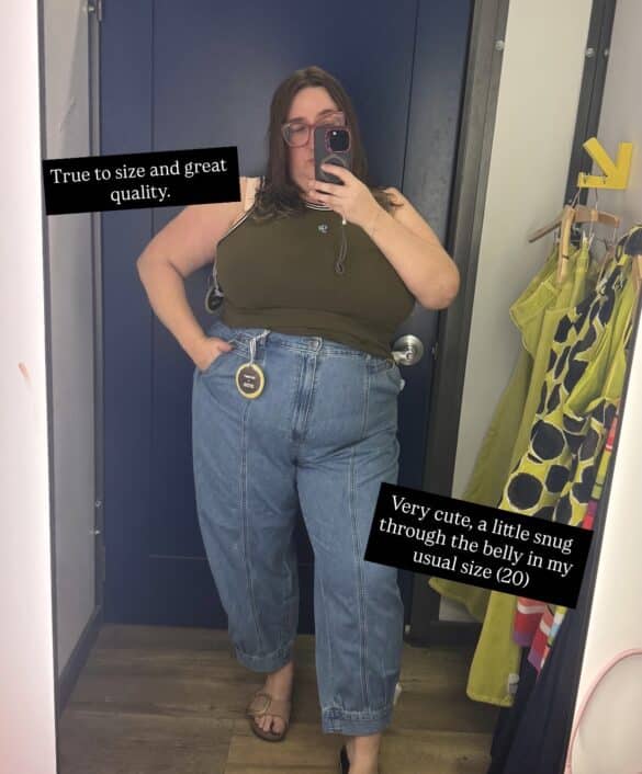 Sarah tries on the olive tank top and barrel leg jeans from the Christopher John Rogers x Old Navy collab