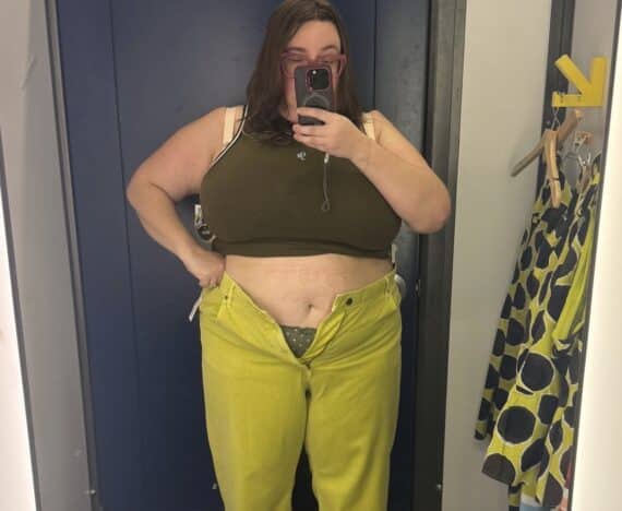Sarah tries on the olive tank top and lime wide leg jeans from the Christopher John Rogers x Old Navy collab